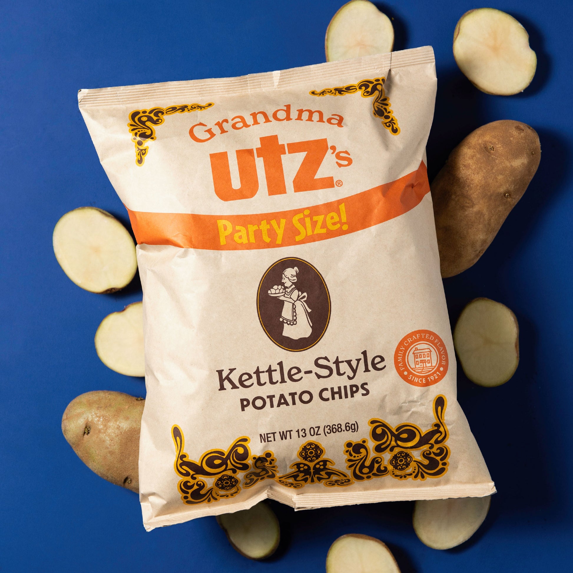 Grandma Utz's Kettle-Style Potato Chips package with potatoes on a blue background