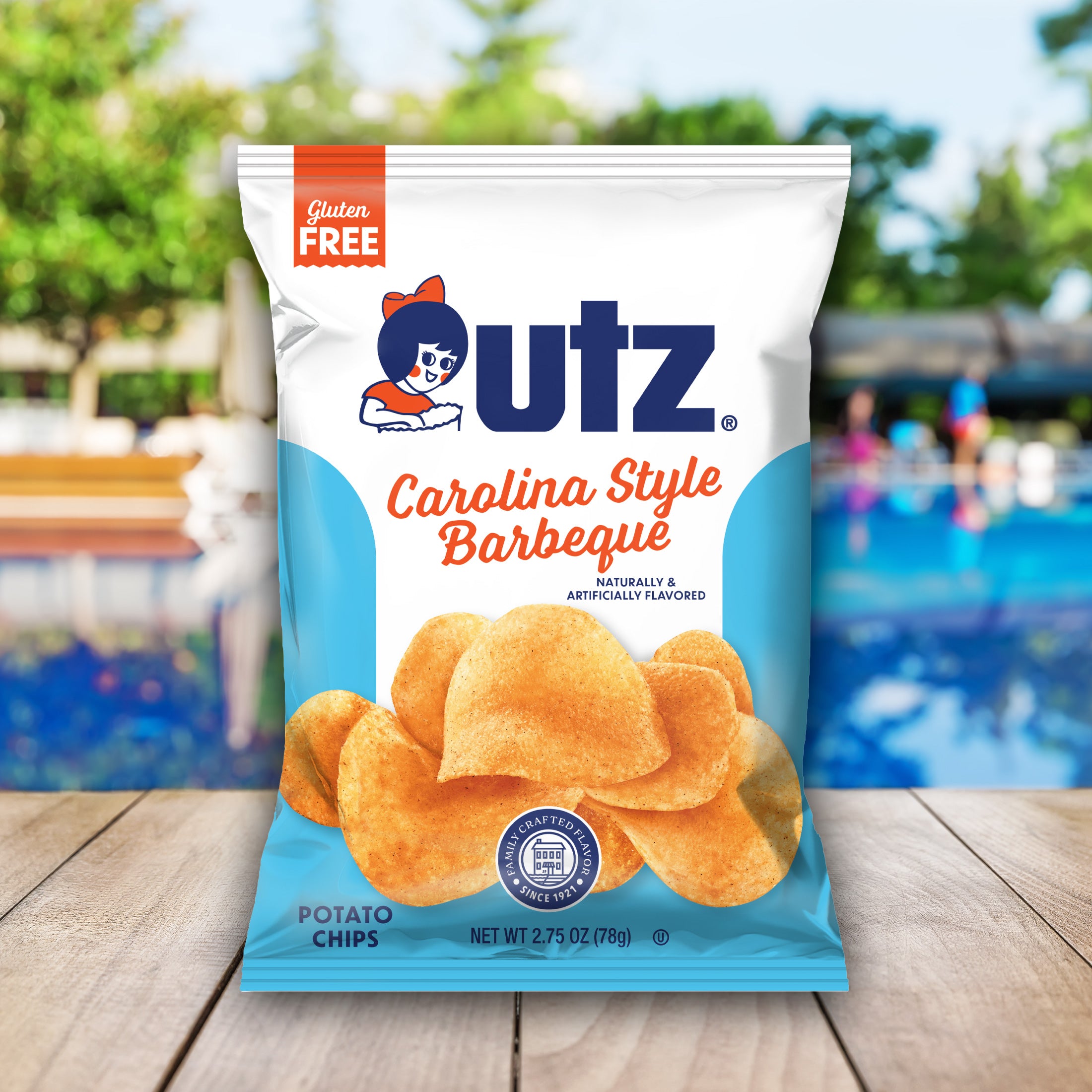 UTZ Carolina Style Barbecue potato chips packaging with a pool and deck chairs in the background