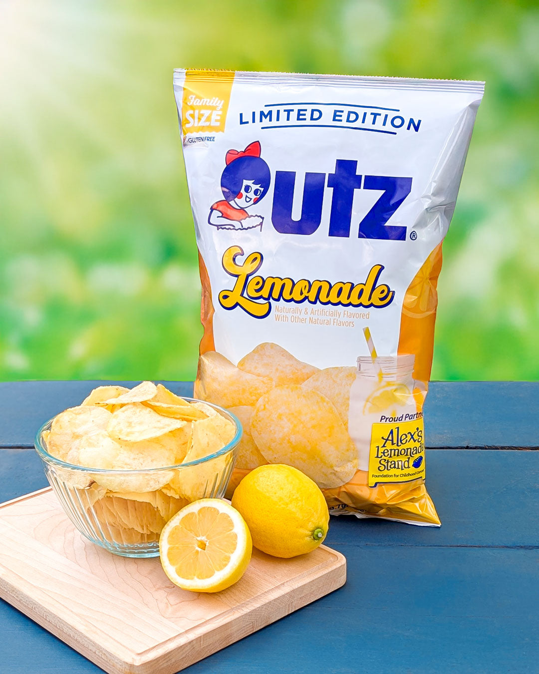 utz Lemonade potato chips with lemon and packaging on a table.