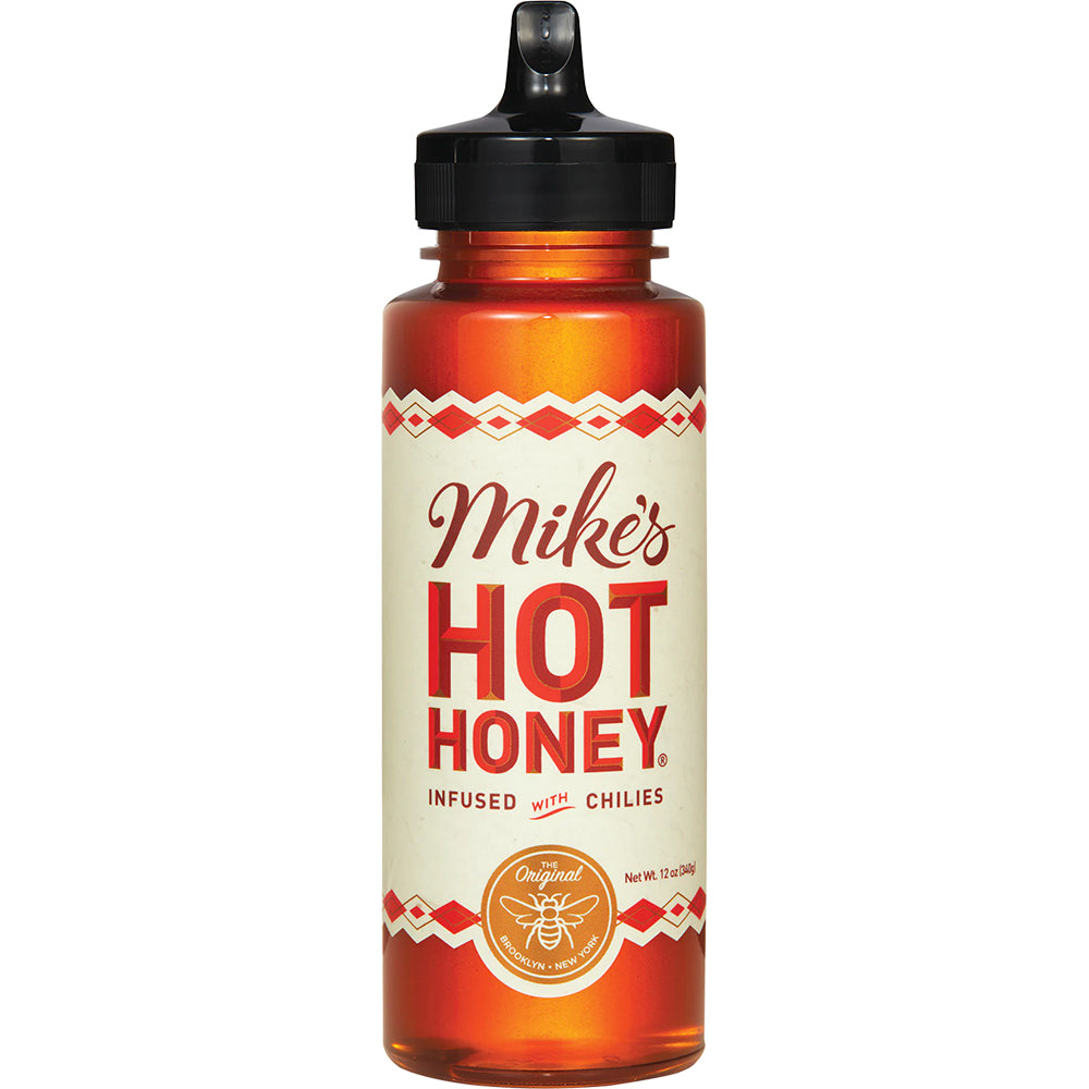 Bottle of Mike's Hot Honey with a white label on a white background
