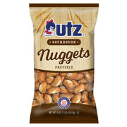 The front of a bag of Utz Sourdough Nuggets with the Utz logo and branding. The bag displays "Sourdough Nuggets" in bold, with a clear window showing pretzel nuggets inside, and has a rustic burlap design background.