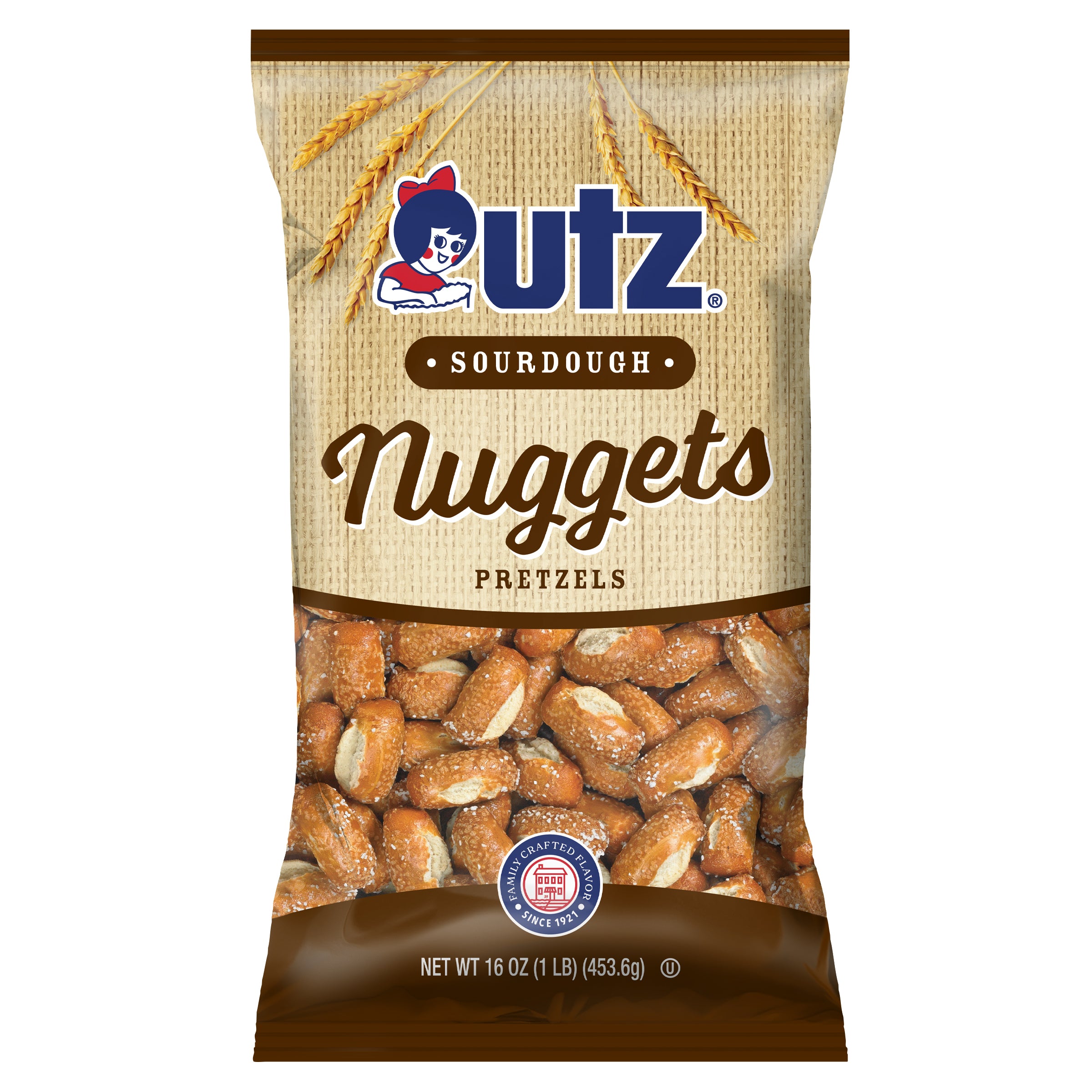 The front of a bag of Utz Sourdough Nuggets with the Utz logo and branding. The bag displays "Sourdough Nuggets" in bold, with a clear window showing pretzel nuggets inside, and has a rustic burlap design background.