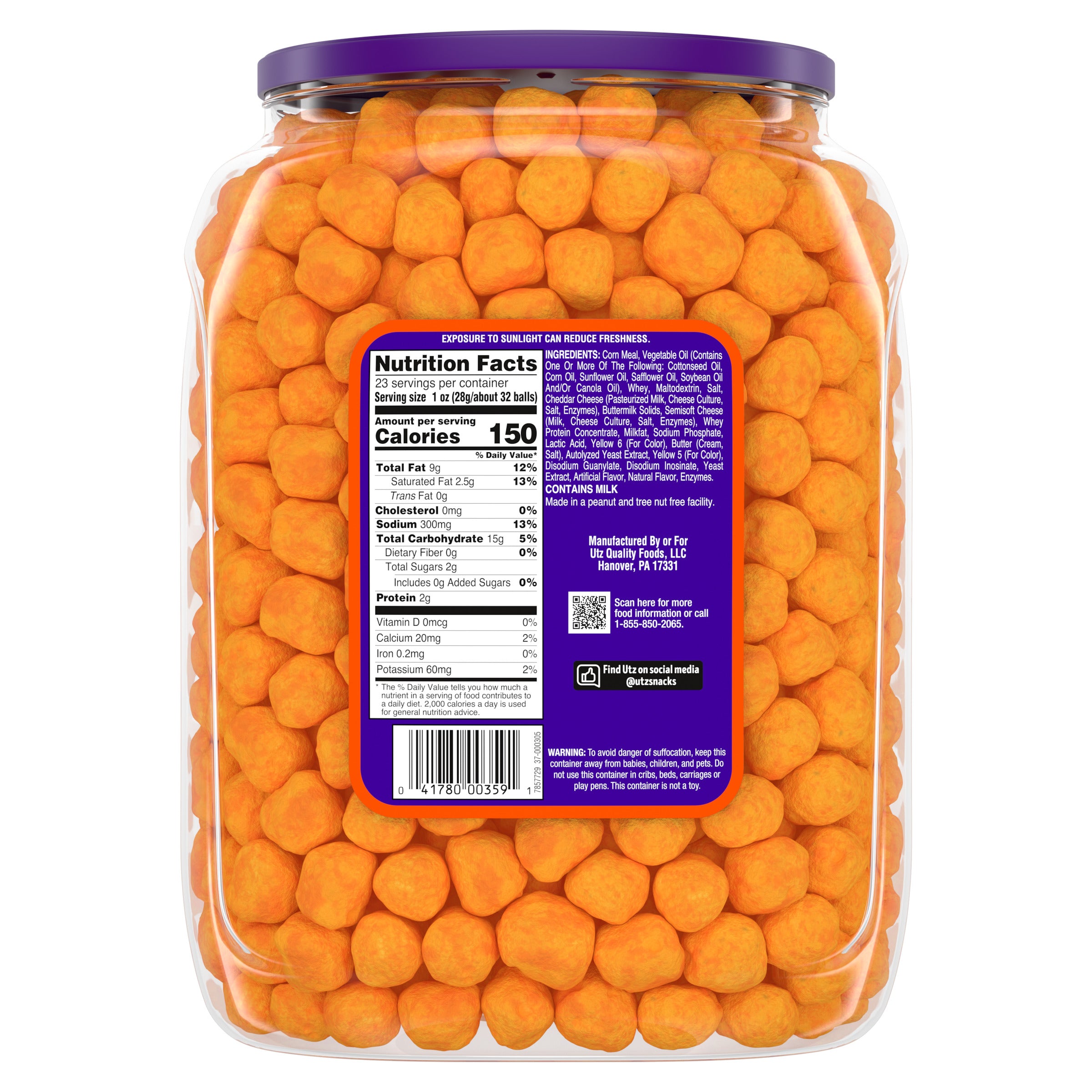 Jar of orange candy with a purple label showing nutrition facts.