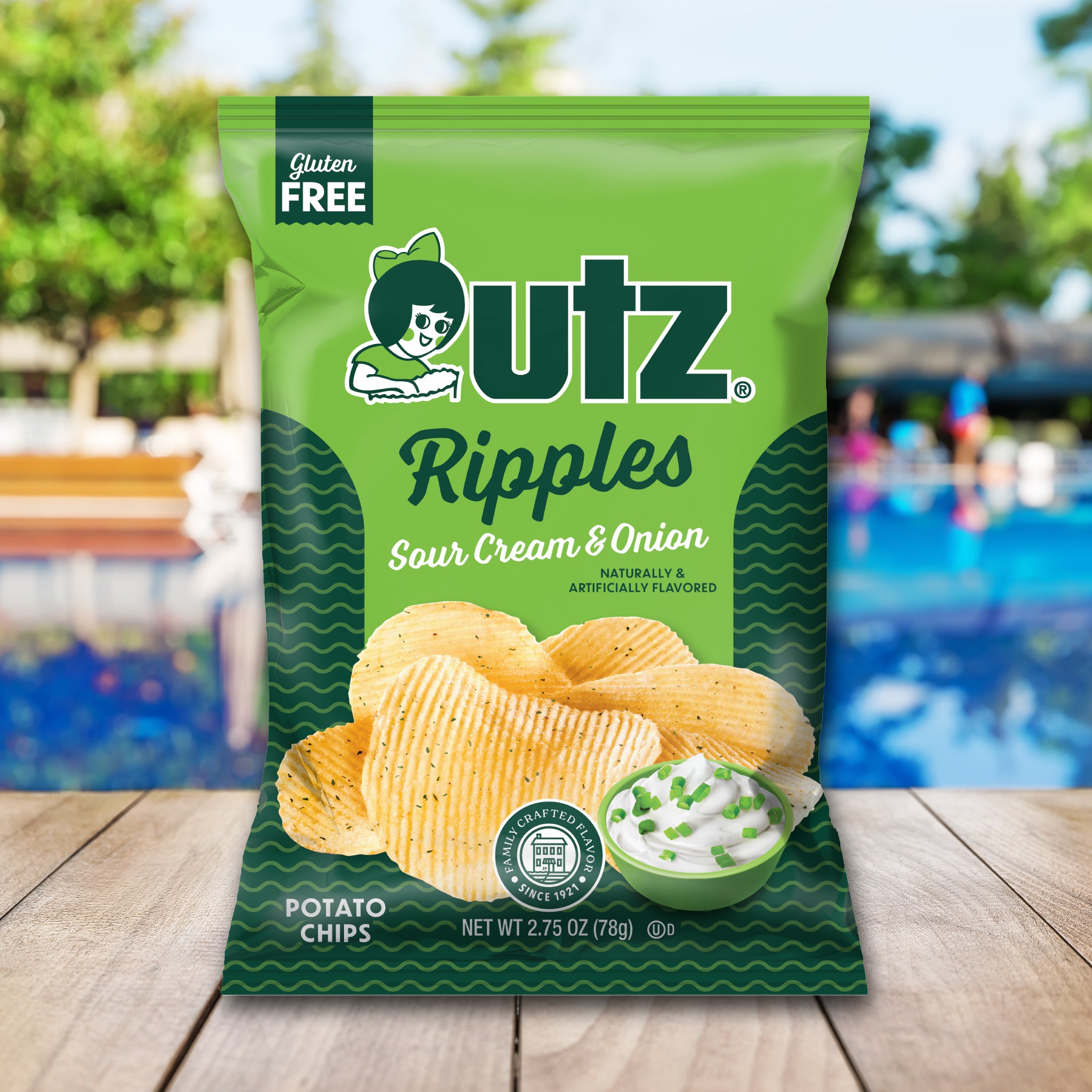 UTZ Ripples Sour Cream & Onion potato chips packaging with a pool and outdoor furniture in the background