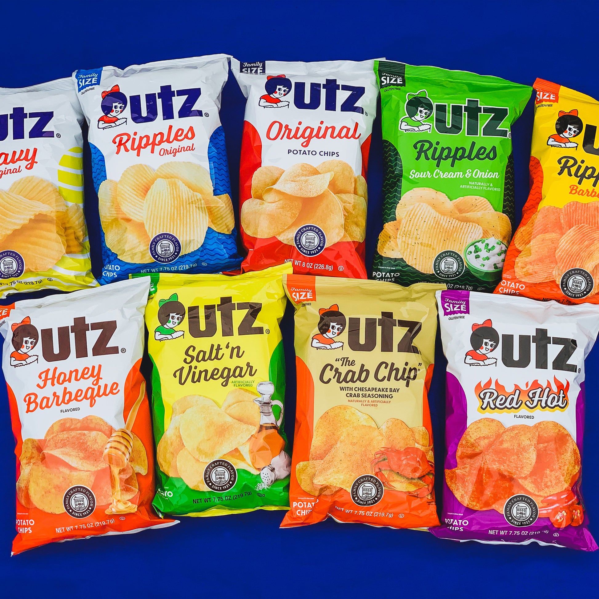 Assorted Utz potato chip packages on a blue background