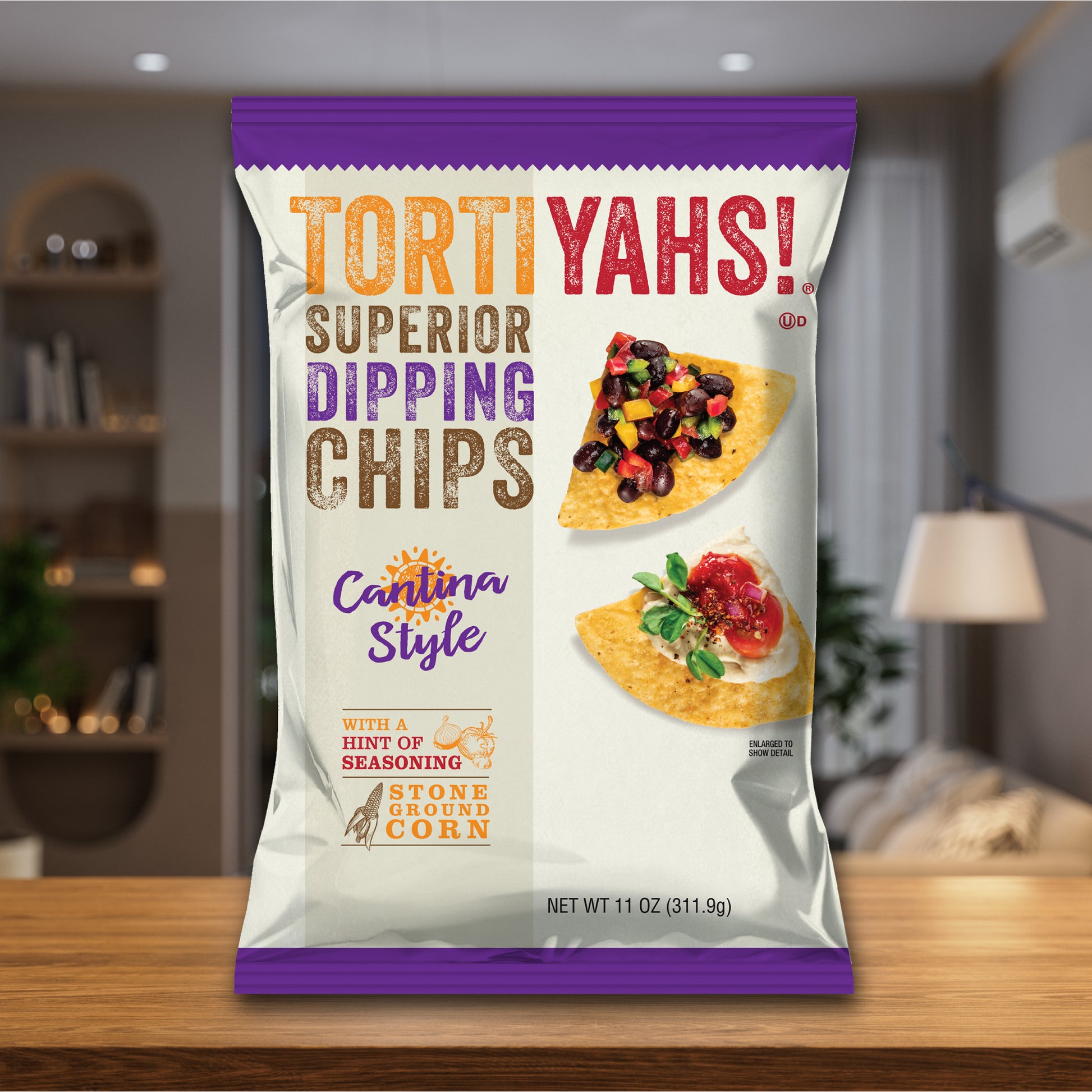 Tortiyahs! Superior Dipping Chips packaging on a wooden surface with a blurred indoor background