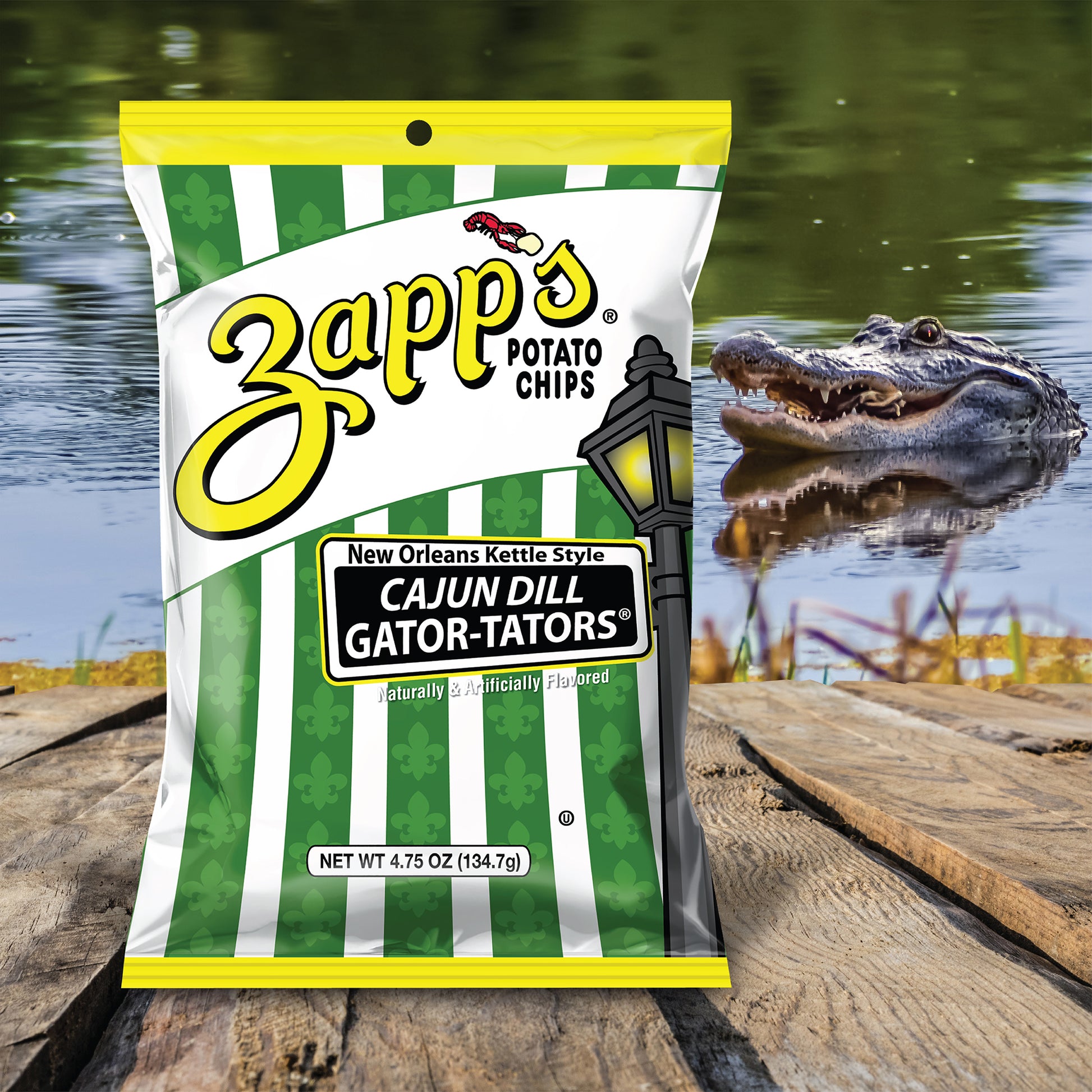 Zapp's Potato Chips Cajun Dill Gator-Taters bag with an alligator in the background