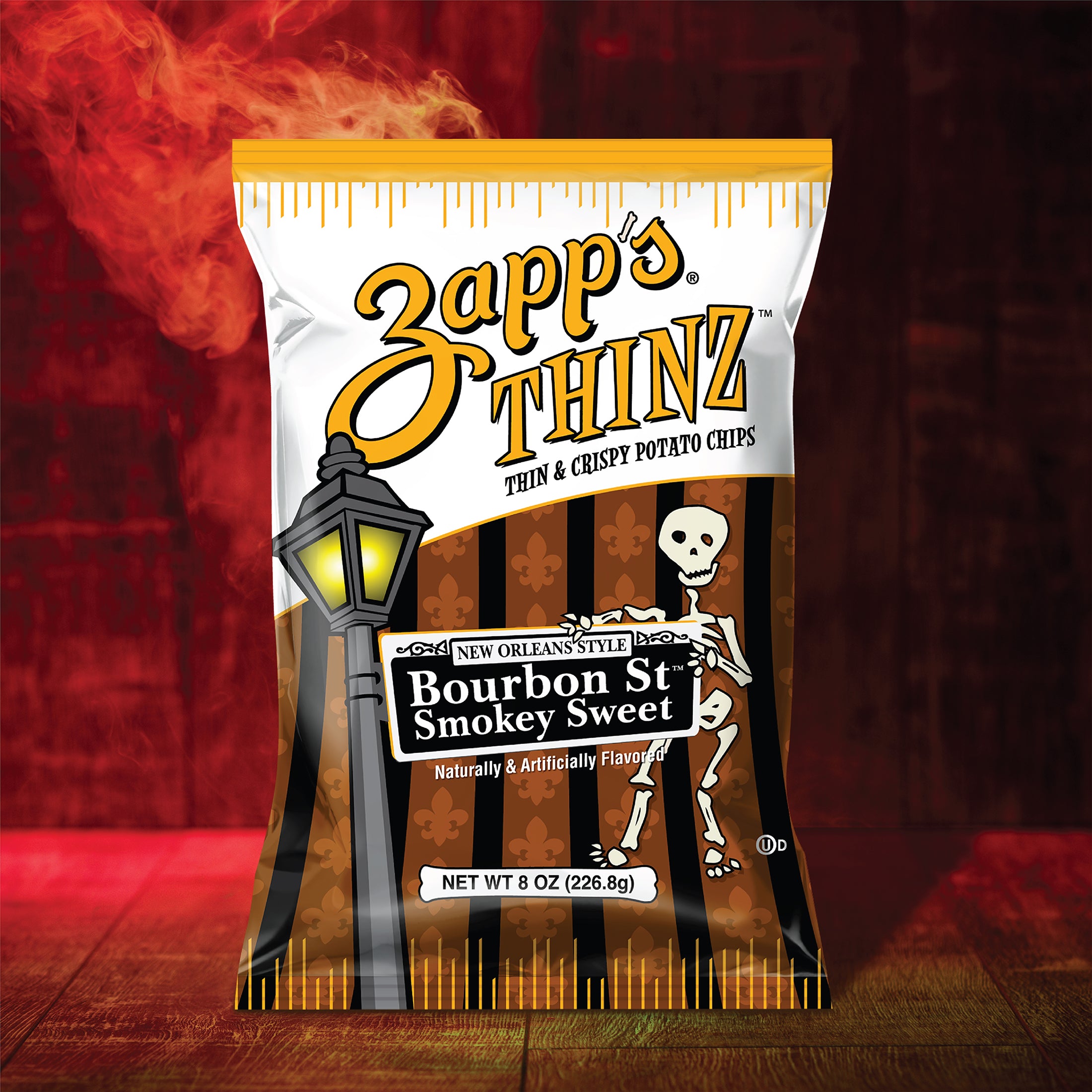 Zapp's Thinz Bourbon St Smokey Sweet potato chips packaging with a skeleton and lamp design on a dark background.