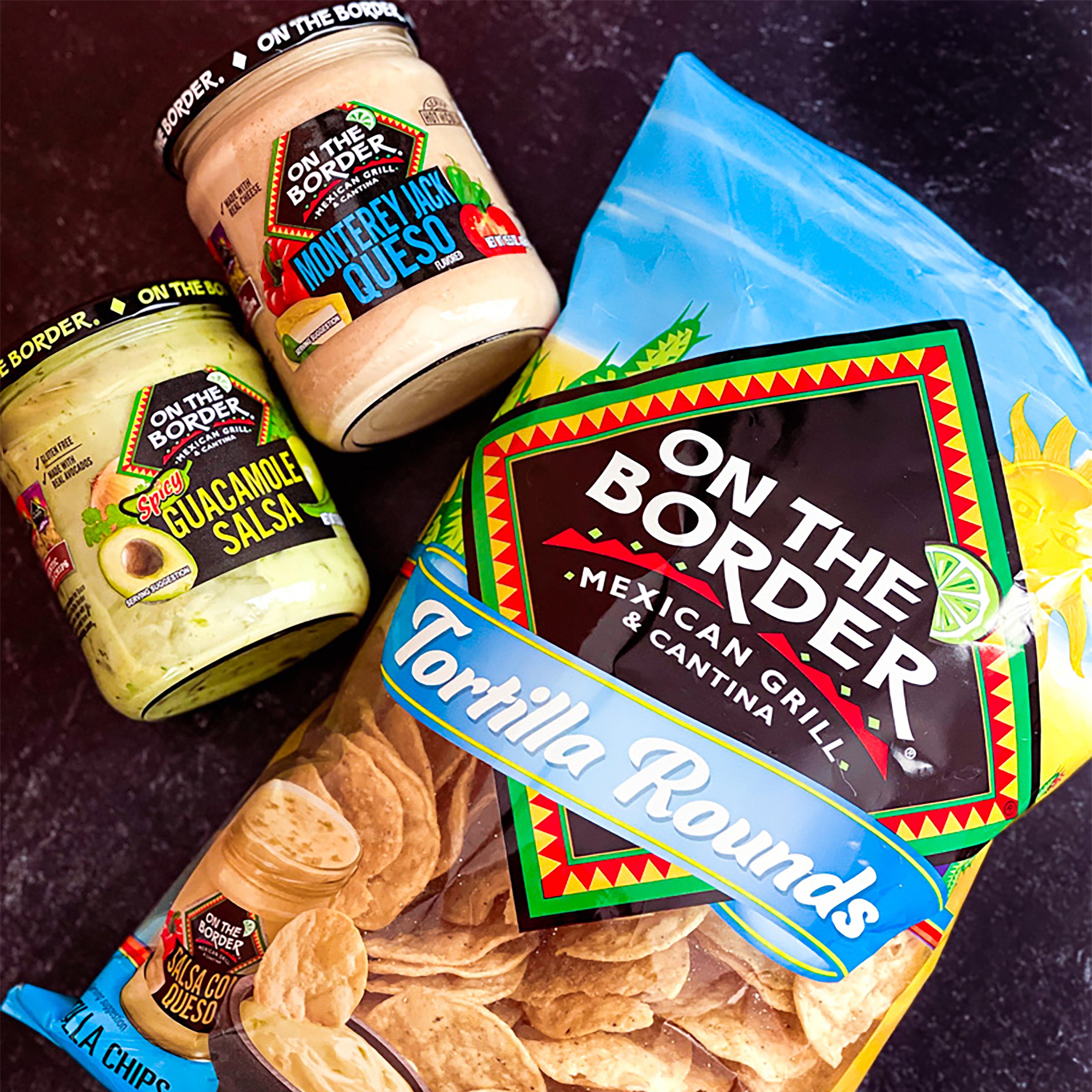 On The Border Mexican Grill & Cantina products including salsa, guacamole, and tortilla rounds on a dark surface.