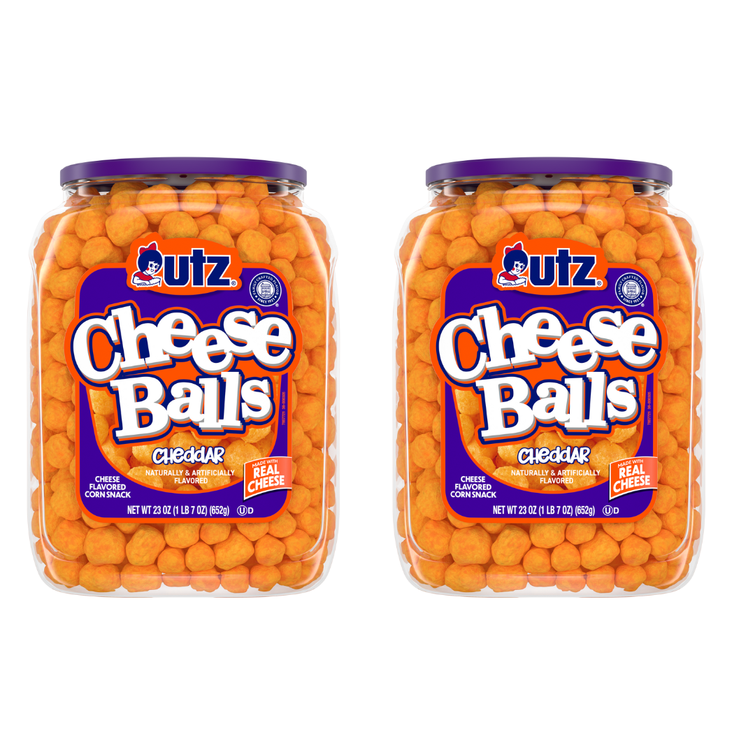 cheese balls | Two jars of Utz Cheddar Cheese Balls. Each jar is filled with orange cheese balls, and the labels indicate the product is a multipack with 2 counts, packaged in 23 oz barrels.