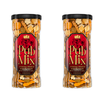 Two transparent containers with black lids, labeled 'Pub Mix' by Utz, filled with a variety of snack foods including pretzels and chips.