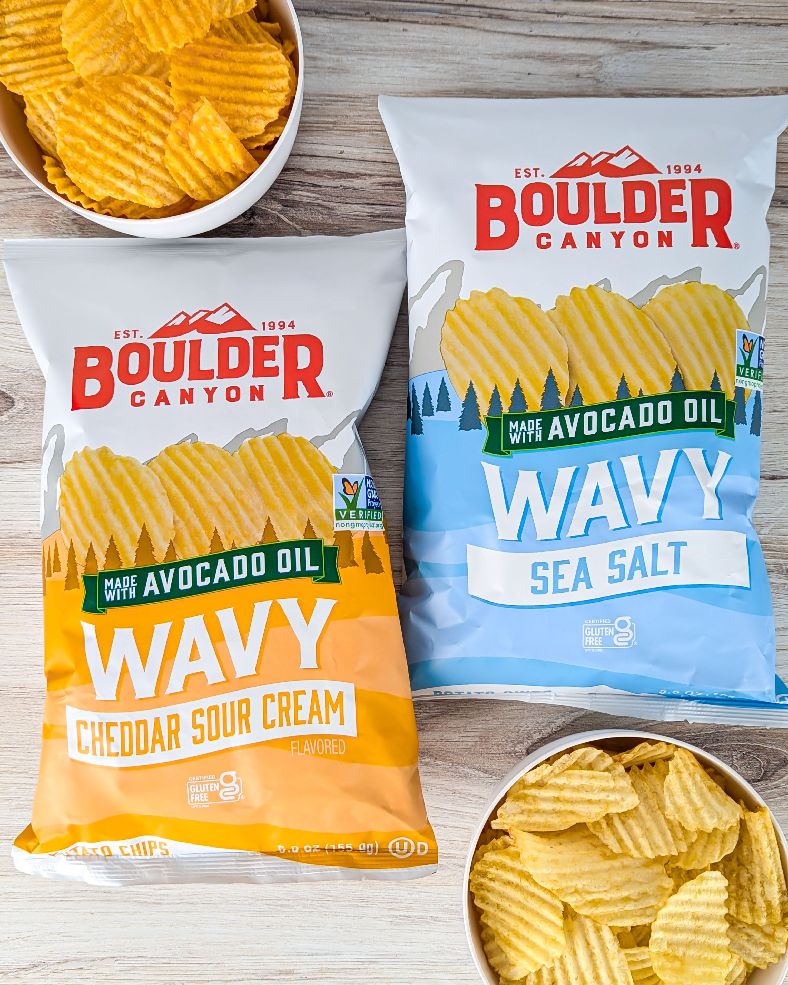 Two bags of wavy avocado oil potato chips.