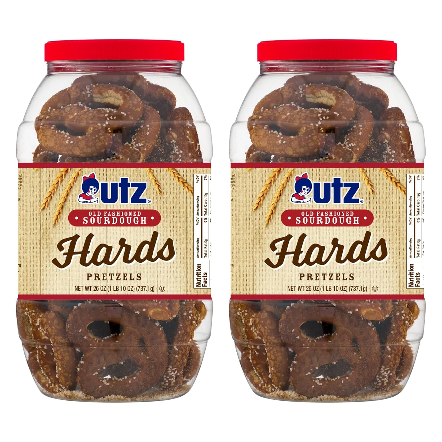 Two clear plastic barrels of Utz Old Fashioned Sourdough Hards Pretzels with red lids and labels, containing pretzels visible through the jars.