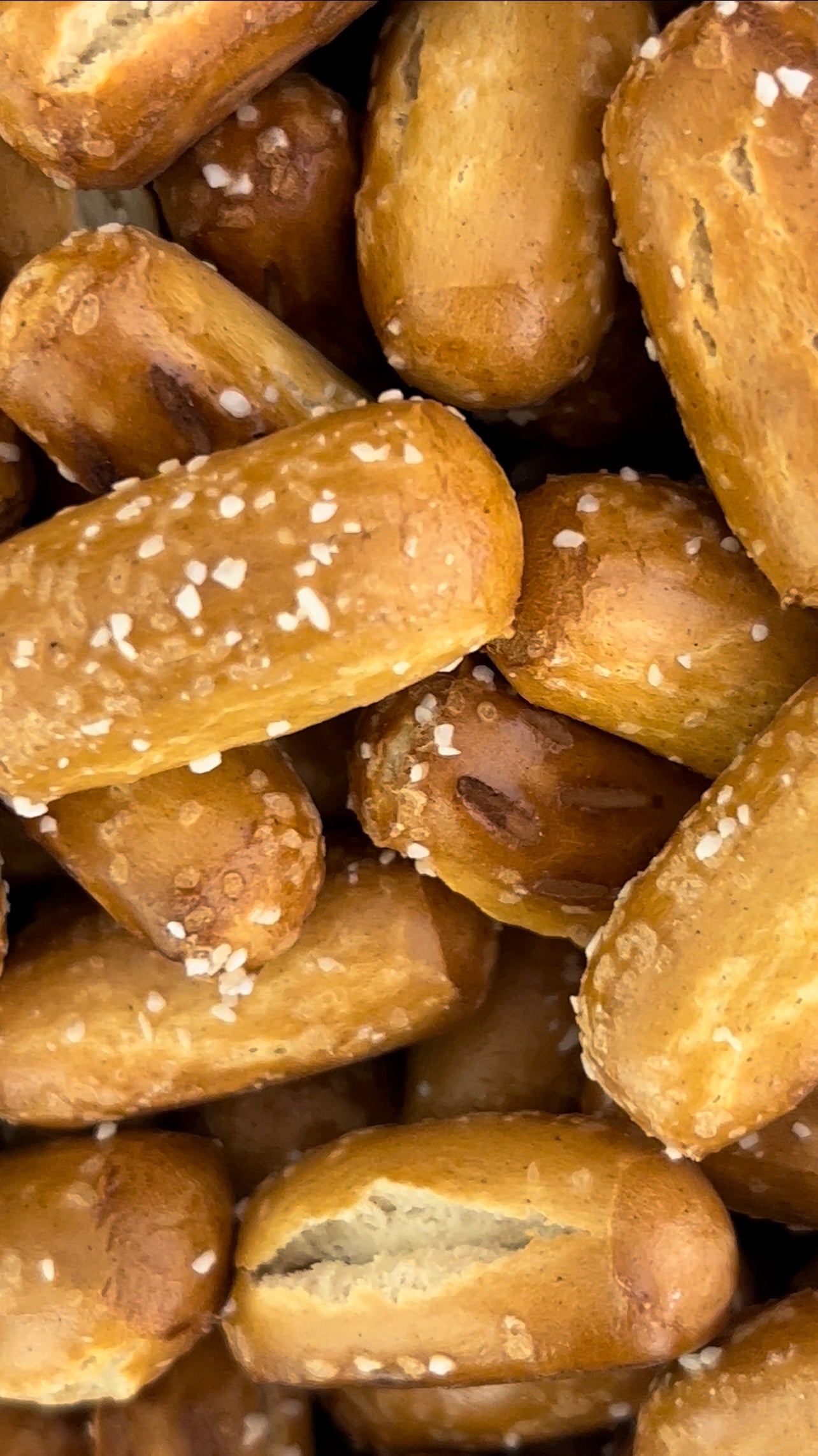 Close-up of salted pretzel rods with a focus on texture and color.