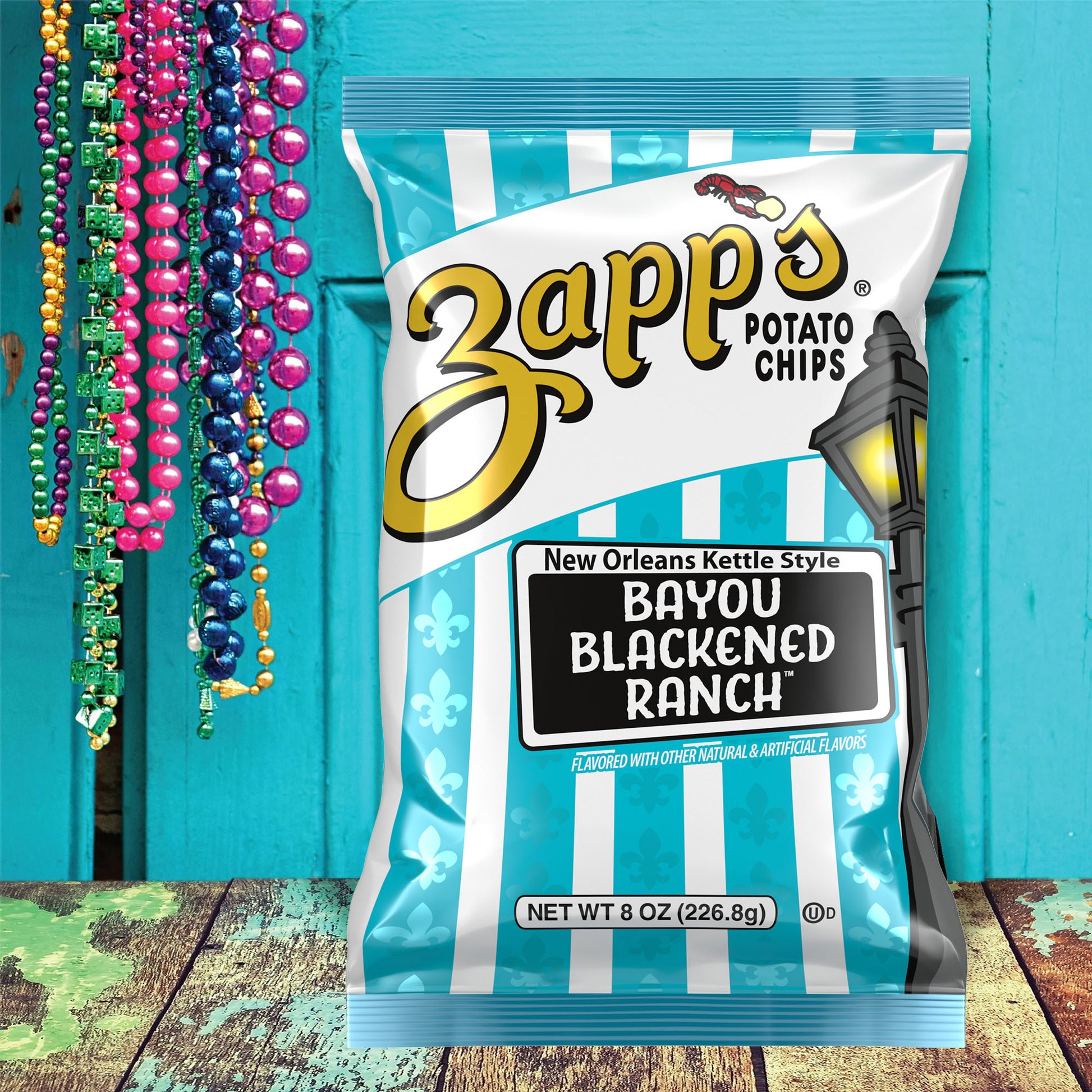 Zapp’s Bayou Blackened Ranch potato chips bag with Mardi Gras beads.