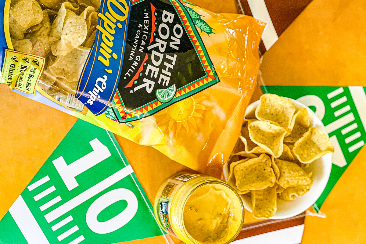 Packaged tortilla chips with 'Bon The Border' branding on a bright background