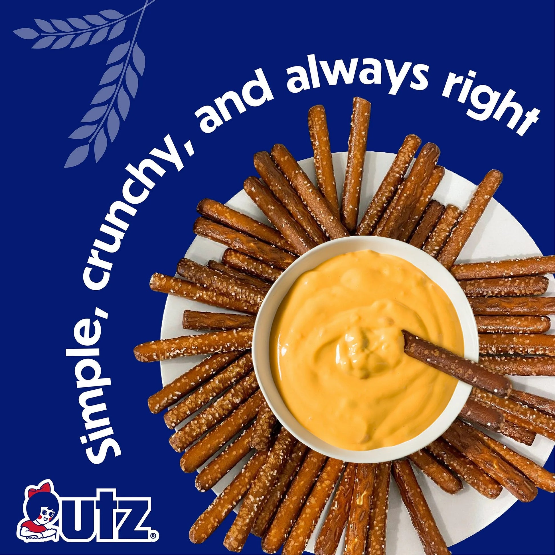 Pretzel sticks arranged in a circular pattern around a bowl of cheese dip on a blue background with text and Quiz brand logo.