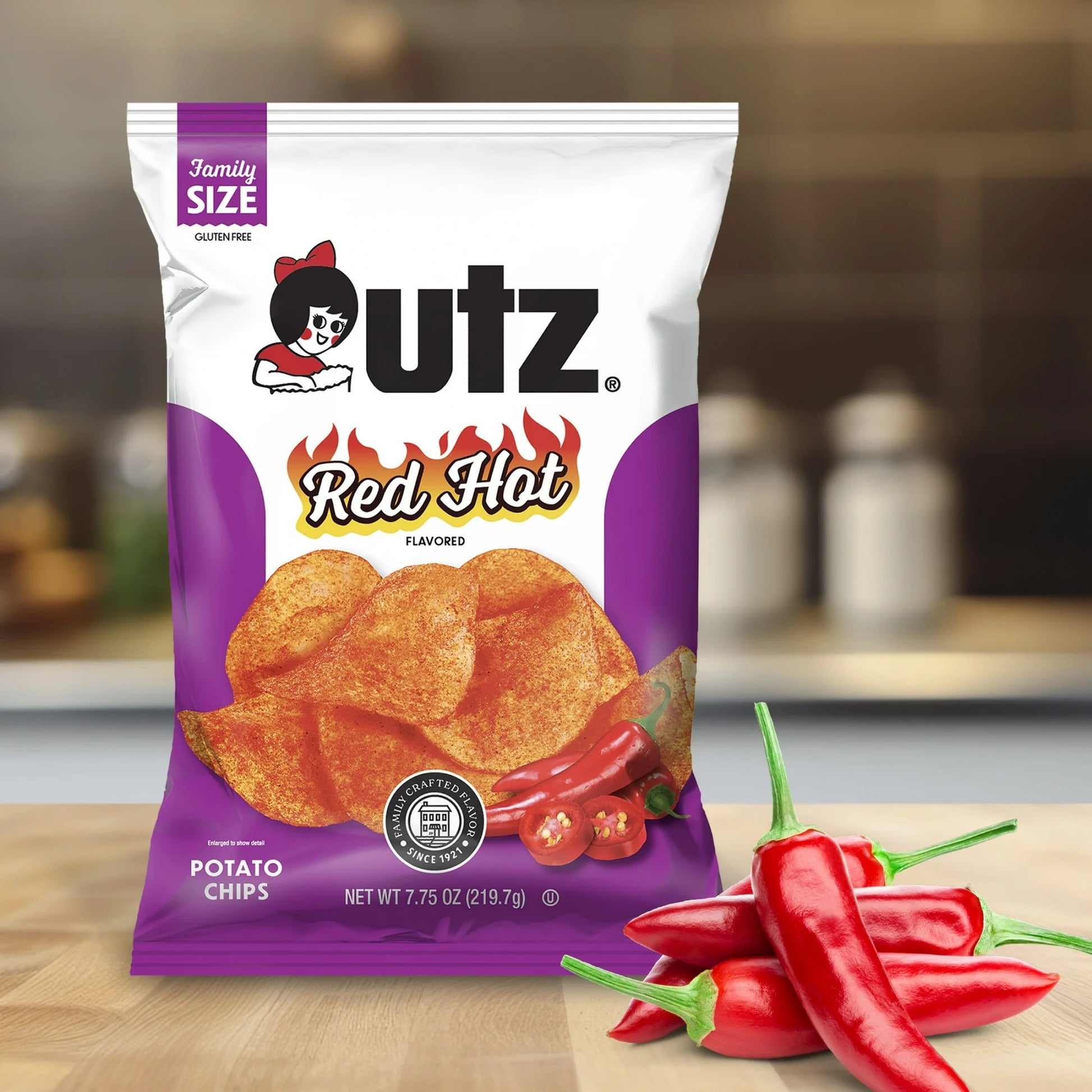 Utz Red Hot potato chips packaging with red peppers on a wooden surface